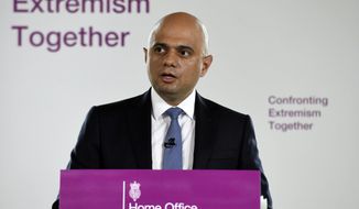 Britain&#39;s Home Secretary Sajid Javid makes a speech in central London, Friday, July 19, 2019. Britain’s home secretary has made a passionate plea for the calming of extreme political rhetoric and offered veiled criticism of President Donald Trump’s use of racially-tinged language. Sajid Javid Friday used a speech on how best to counter extremism to warn that excessive language is spreading hate and working people into a frenzy. (Stefan Rousseau/PA via AP)