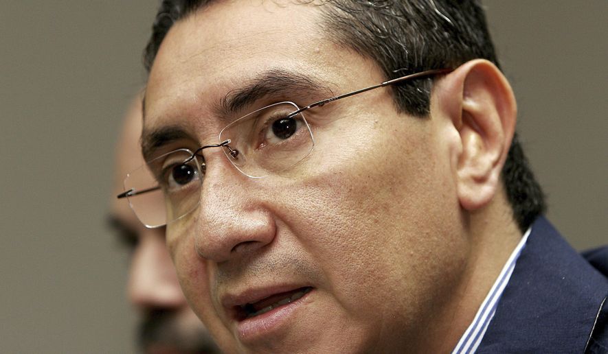 FILE - In this Feb 26, 2007 file photo, then El Salvador's Justice and Public Security Minister Rene Figueroa speaks during a press conference in San Salvador. Prosecutors presented a complaint Friday, July 19, 2019, accusing the ex-minister and his wife Cecilia of illicit enrichment. He was in the Cabinet of former President Tony Saca, who is serving a 10-year prison term for diverting $301 million to favor his businesses and third parties. (AP Photo/Luis Romero, File)