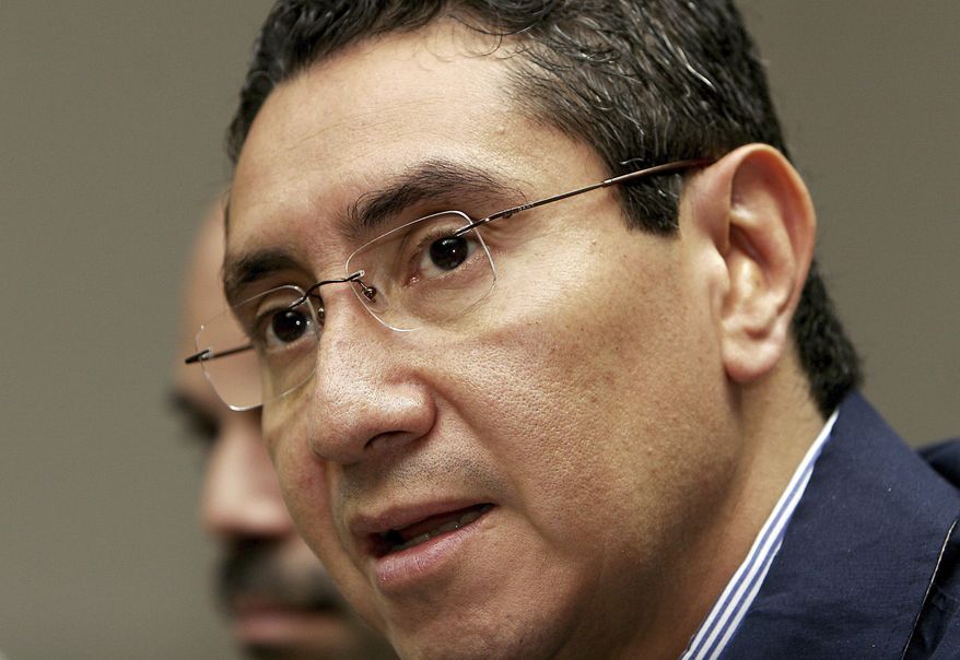 FILE - In this Feb 26, 2007 file photo, then El Salvador's Justice and Public Security Minister Rene Figueroa speaks during a press conference in San Salvador. Prosecutors presented a complaint Friday, July 19, 2019, accusing the ex-minister and his wife Cecilia of illicit enrichment. He was in the Cabinet of former President Tony Saca, who is serving a 10-year prison term for diverting $301 million to favor his businesses and third parties. (AP Photo/Luis Romero, File)