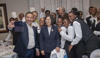 In this photo released by the Taiwan Presidential Office, Taiwanese President Tsai Ing-wen poses for photos in St. Lucia on Thursday, July 18, 2019. Tsai said she would follow &amp;quot;humanitarian principles&amp;quot; in dealing with asylum seekers from Hong Kong during a visit this week to Saint Lucia, an eastern Caribbean island nation that is among Taiwan&#39;s few remaining allies. (Taiwan Presidential Office via AP)