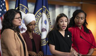 In this July 15, 2019, photo, Rep. Alexandria Ocasio-Cortez, D-N.Y., speaks as, from left, Rep. Rashida Tlaib, D-Mich., Rep. Ilhan Omar, D-Minn., and Rep. Ayanna Pressley, D-Mass., listen during a news conference at the Capitol in Washington. Long before President Donald Trump attacked the four Democratic congresswomen of color, saying they should “go back” to their home countries, they were targets of hateful rhetoric and disinformation online.(AP Photo/J. Scott Applewhite) **FILE**