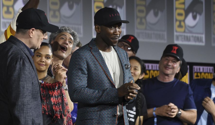 Mahershala Ali, center, wears a hat to promote his new movie "Blade" at the Marvel Studios panel on day three of Comic-Con International on Saturday, July 20, 2019, in San Diego. (Photo by Chris Pizzello/Invision/AP)