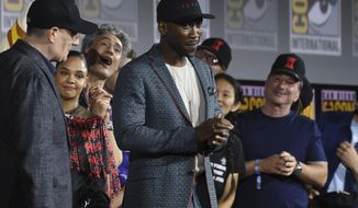 Mahershala Ali, center, wears a hat to promote his new movie &amp;quot;Blade&amp;quot; at the Marvel Studios panel on day three of Comic-Con International on Saturday, July 20, 2019, in San Diego. (Photo by Chris Pizzello/Invision/AP)