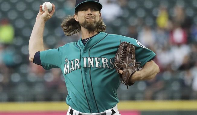 Seattle Mariners starting pitcher Mike Leake throws against the Los Angeles Angels during the fifth inning of a baseball game, Friday, July 19, 2019, in Seattle. (AP Photo/Ted S. Warren)
