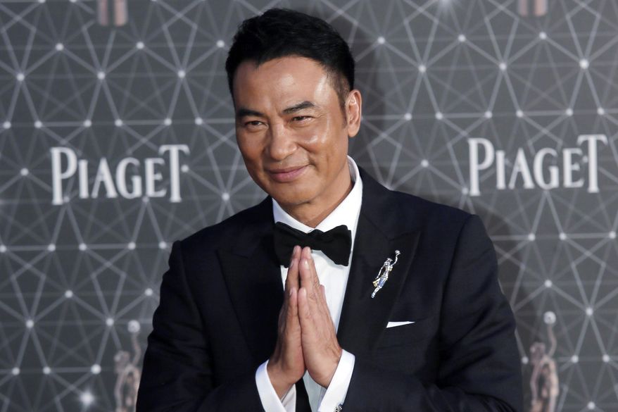 FILE - In this file photo taken Sunday, April 3, 2016, Hong Kong actor Simon Yam poses on the red carpet of the Hong Kong Film Awards in Hong Kong. Yam was stabbed Saturday, July 20, 2019 while attending an event in southern China. (AP Photo/Vincent Yu, File)