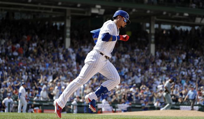 Chicago Cubs&#x27; Javier Baez rounds the bases after hitting a three-run home run during the fourth inning of a baseball game against the San Diego Padres in Chicago, Saturday, July 20, 2019. (AP Photo/Nam Y. Huh)