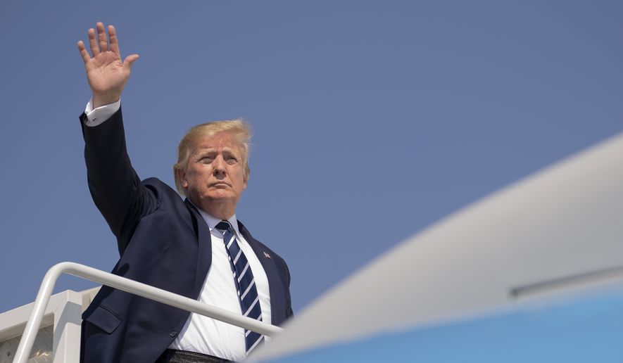 President Donald Trump waves as he boards Air Force One at Morristown Municipal Airport, in Morristown, N.J., on his way returning back to the White House Sunday, July 21, 2019. (AP Photo/Manuel Balce Ceneta)