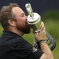 Ireland&#39;s Shane Lowry holds and kisses the Claret Jug trophy after winning the British Open Golf Championships at Royal Portrush in Northern Ireland, Sunday, July 21, 2019.(AP Photo/Peter Morrison)