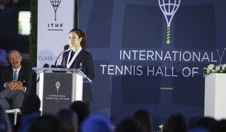 Tennis Hall of Fame inductee Li Na, of China, speaks to the crowd during ceremonies at the International Tennis Hall of Fame, Saturday, July 20, 2019, in Newport, R.I. (AP Photo/Stew Milne)