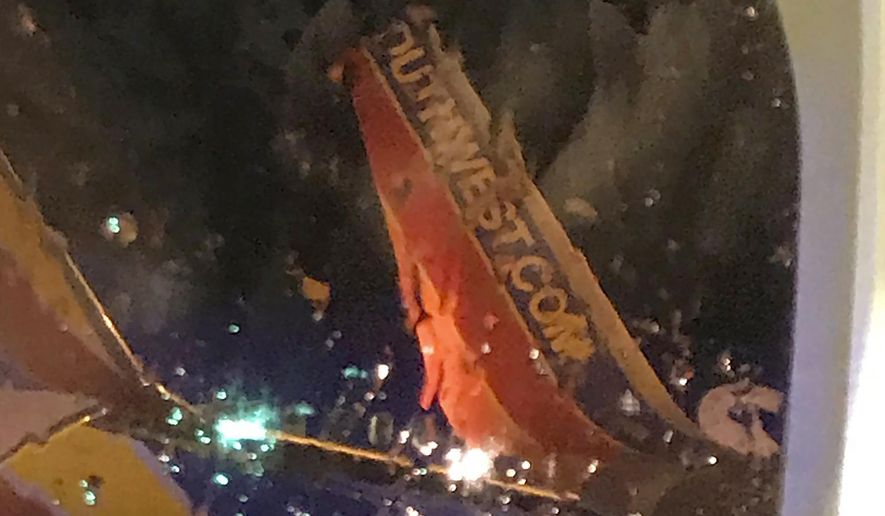 This photo taken onboard by a passenger on a Southwest Airlines flight to Atlanta appears to show the top fin of another Southwest Airlines plane clipped off after the two planes collided, Saturday, July 20, 2019, on the tarmac of Nashville International Airport, in Nashville, Tenn. The airline says both planes returned to the gate &amp;quot;under their own power&amp;quot; and were taken out of service for evaluation. The Southwest flights will continue to the scheduled destinations using news planes. (Eric Borden via AP)