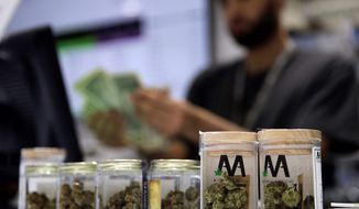 Nevada state officials will allow marijuana businesses to deal in electronic tokens and chips as dispensaries are increasingly targeted for burglaries and robberies. (ASSOCIATED PRESS)