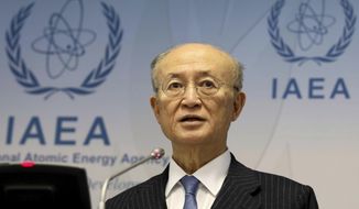 In this Nov. 22, 2018, file photo, International Atomic Energy Agency (IAEA) Director General Yukiya Amano of Japan addresses the media during a news conference after a meeting of the IAEA board of governors at the International Center in Vienna, Austria. The IAEA said Tuesday, July 22, 2019, it is announcing with regret the death of Amano. The Secretariat did not say how Amano, who was 72, died. (AP Photo/Ronald Zak)