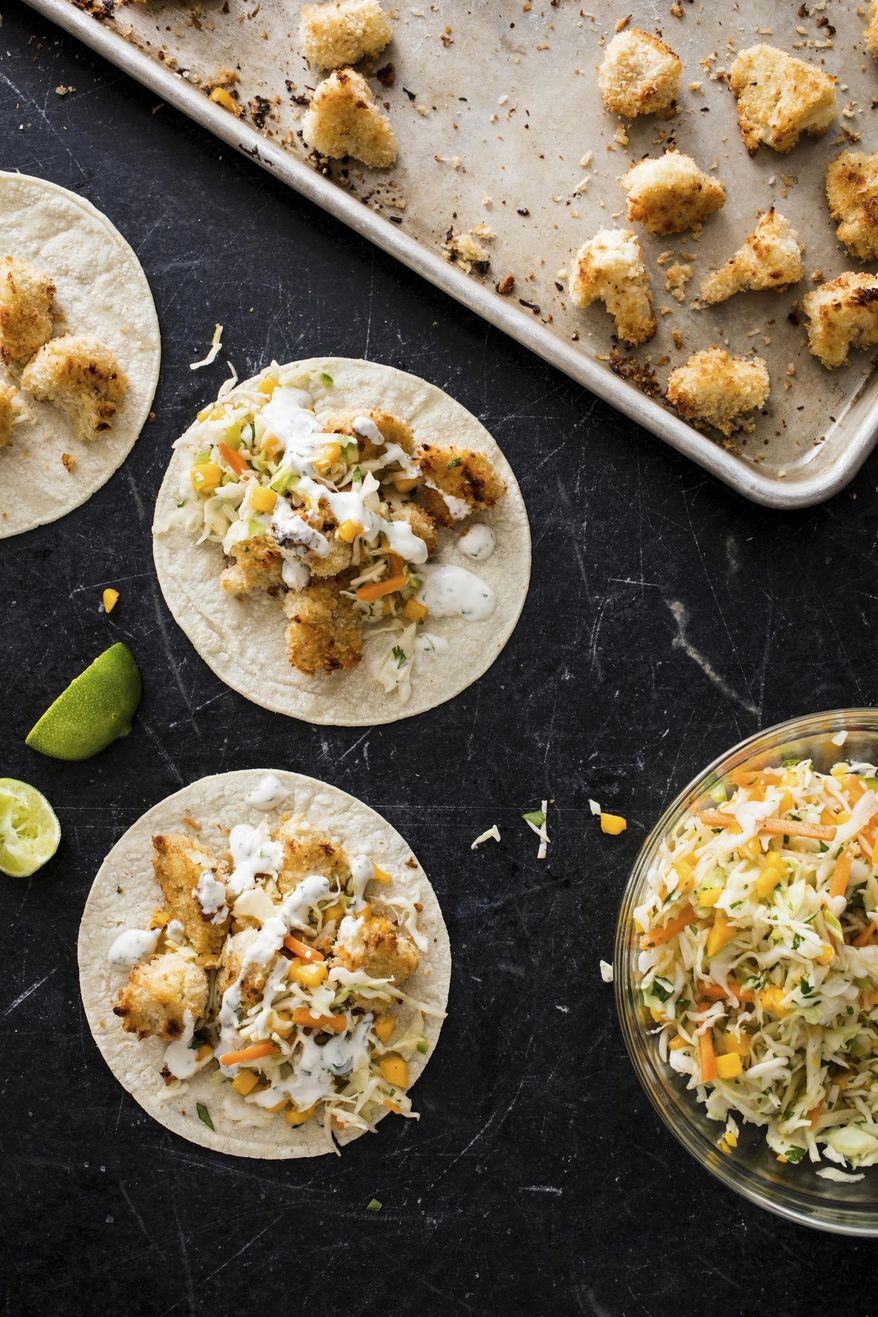 This undated photo provided by America's Test Kitchen in July 2019 shows Baja-Style Cauliflower Tacos in Brookline, Mass. This recipe appears in the cookbook “Vegan for Everybody.” (Daniel J. van Ackere/America's Test Kitchen via AP)
