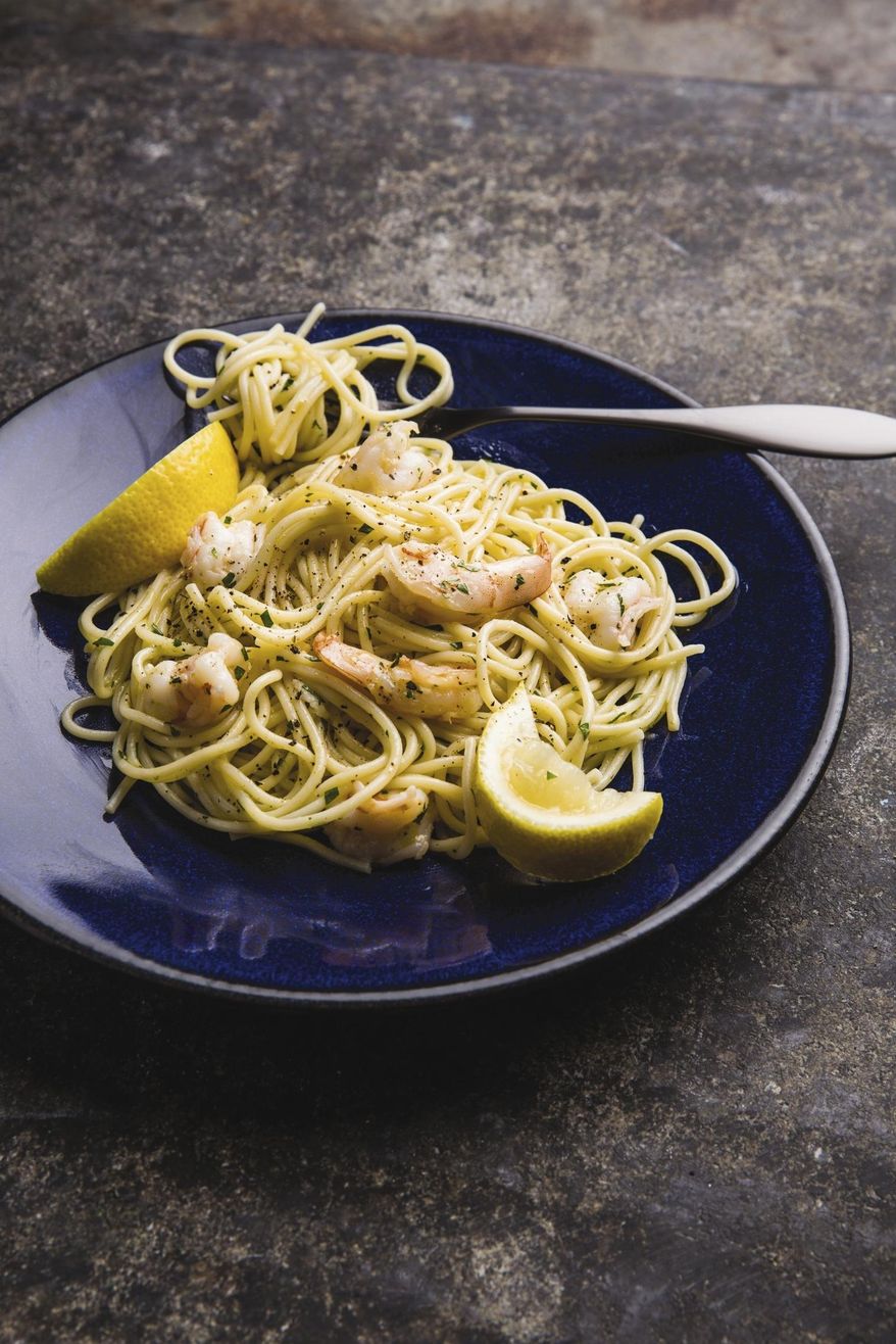 This undated photo provided by America's Test Kitchen in July 2019 shows Spaghettini with Shrimp in Brookline, Mass. This recipe appears in the cookbook "Tasting Italy." (Joe Keller/America's Test Kitchen via AP)