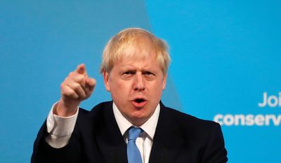 Boris Johnson gestures as he speaks after being announced as the new leader of the Conservative Party in London, Tuesday, July 23, 2019. Brexit champion Boris Johnson won the contest to lead Britain&#39;s governing Conservative Party on Tuesday, and will become the country&#39;s next prime minister. (AP Photo/Frank Augstein)