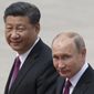 In this June 8, 2018, Russian President Vladimir Putin, right, and Chinese President Xi Jinping walk together during a welcome ceremony outside the Great Hall of the People in Beijing, China. If Donald Trump is serious about his public courtship of Vladimir Putin, he may want to take pointers from one of the Russian leader&#39;s longtime suitors: Chinese President Xi Jinping. In this political love triangle, Putin and Xi are tied by strategic need and a rare dose of personal affection, while Trump&#39;s effusive display in Helsinki showed him as an earnest admirer of the man leading a country long considered America&#39;s adversary. (AP Photo/Alexander Zemlianichenko, File)