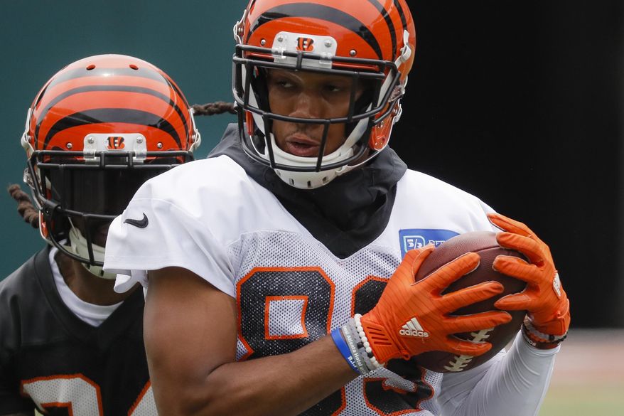 FILE - In this June 12, 2019 file photo Cincinnati Bengals wide receiver Tyler Boyd participates during practice at the team's NFL football facility in Cincinnati. Receiver Tyler Boyd signed a four-year contract extension on Tuesday, July 23, 2019 coming off his breakthrough season with the Cincinnati Bengals. (AP Photo/John Minchillo, File)