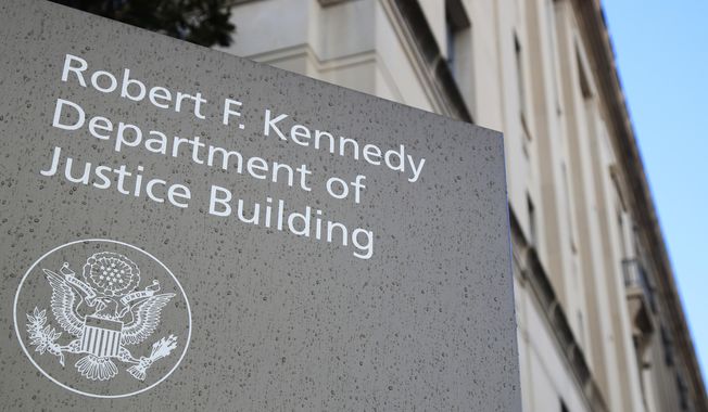 This Friday, March 22, 2019, photo shows the Department of Justice Building in Washington. (AP Photo/Manuel Balce Ceneta) ** FILE **