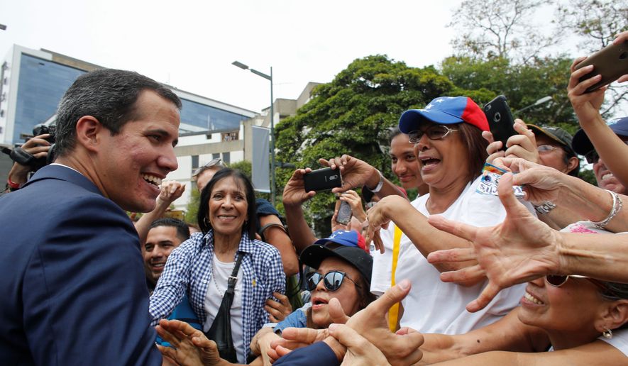 The next round of U.S. sanctions against Venezuela are coming, said special representative to Venezuela Elliott Abrams. Those sanctions give opposition leader Juan Guiado (left) leverage against President Nicolas Maduro.
Opposition leader and self-proclaimed interim president of Venezuela Juan Guaido greets supporters at the end of a rally in Caracas, Venezuela, Tuesday, July 23, 2019. The National Assembly approved on Tuesday the return of Venezuela to the Inter-American Treaty of Reciprocal Assistance to strengthen cooperation with the countries of the region and raise pressure on President Nicolas Maduro. (AP Photo/Ariana Cubillos) (Associated Press)