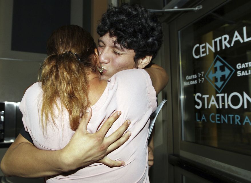 Francisco Galicia, right, kisses his mother Sanjuana Galicia at the McAllen, Texas, Central Station, Wednesday, July 24, 2019. Galicia, 18, who was born in the U.S. was released Tuesday, July 23, from federal immigration custody after wrongfully being detained for more than three weeks. (Delcia Lopez/The Monitor via AP)