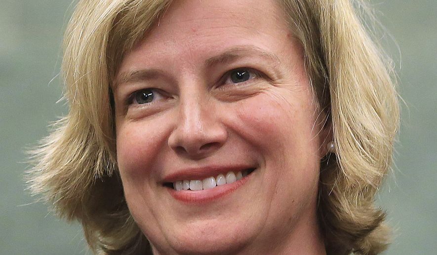 In this Oct. 12, 2012, file photo, Kristine Baker smiles after being sworn in as a U.S. District judge for the Eastern District of Arkansas in Little Rock. Baker blocked three new abortion restrictions from taking effect Wednesday, July 24, 2019, in Arkansas, including a measure that opponents say would likely force the state’s only surgical abortion clinic to close. (Rick McFarland/The Arkansas Democrat-Gazette via AP, File)