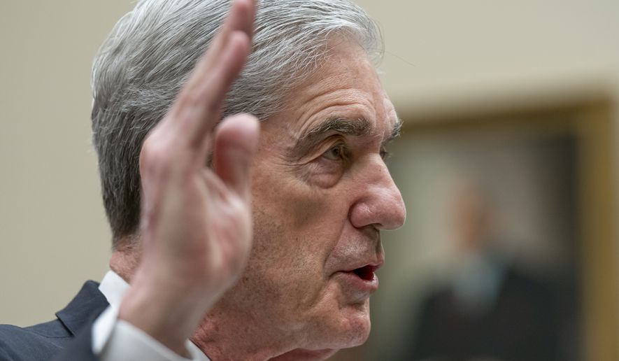 Former special counsel Robert Mueller is sworn in to testify to the House Judiciary Committee about his investigation into President Donald Trump and Russian interference in the 2016 election, on Capitol Hill in Washington, Wednesday, July 24, 2019. (AP Photo/J. Scott Applewhite)