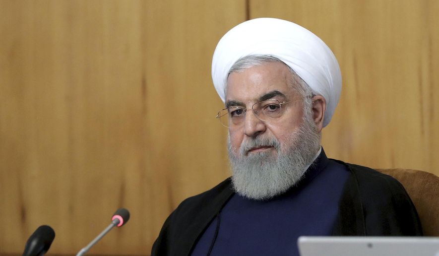 In this photo released by the office of the Iranian Presidency, President Hassan Rouhani speaks in a Cabinet meeting in Tehran, Iran, Wednesday, July 24, 2019. Rouhani suggested on Wednesday that Iran might release a U.K.-flagged ship if Britain takes similar steps to release an Iranian oil tanker seized by the British Royal Navy off Gibraltar earlier this month. (Iranian Presidency Office via AP)