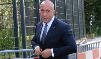 Former Kosovo Prime Minister Ramush Haradinaj arrives for a Kosovo tribunal, at the Hague, Netherlands,  Wednesday, July 24, 2019. Haradinaj will be questioned by a special court investigating alleged war crimes by members of the separatist Kosovo Liberation Army two decades ago. (AP Photo/Michael Corder)