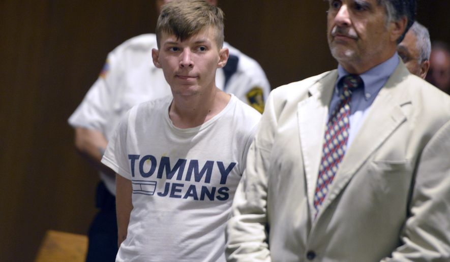FILE - In this June 24, 2019 file photo, Volodymyr Zhukovskyy, 23, of West Springfield, and the driver of a pickup truck in a fiery collision on a rural New Hampshire highway that killed seven motorcyclists, stands with his attorney Donald Frank during his arraignment in Springfield District Court in Springfield, Mass. In a preliminary report released Wednesday, July 24, 2019, the National Transportation Safety Board summarized the details behind the June 21 crash in which a pickup truck driven by Zhukovskyy crashed into the bikers in Randolph, N.H. The report affirms early reports that Zhukovskyy crossed the center of the road and collided with the bikers. (Don Treeger/The Republican via AP, Pool, File)