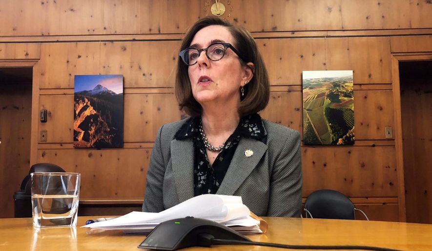 In this Monday, July 1, 2019 file photo, Oregon Gov. Kate Brown speaks with the media at the Capitol in Salem, Ore. Legislation allowing certain terminally ill patients to have quicker access to life-ending medications under the state&#39;s first-in-the-nation assisted suicide law has been signed into law, Gov. Brown&#39;s office announced Wednesday, July 24. (AP Photo/Sarah Zimmerman, File)