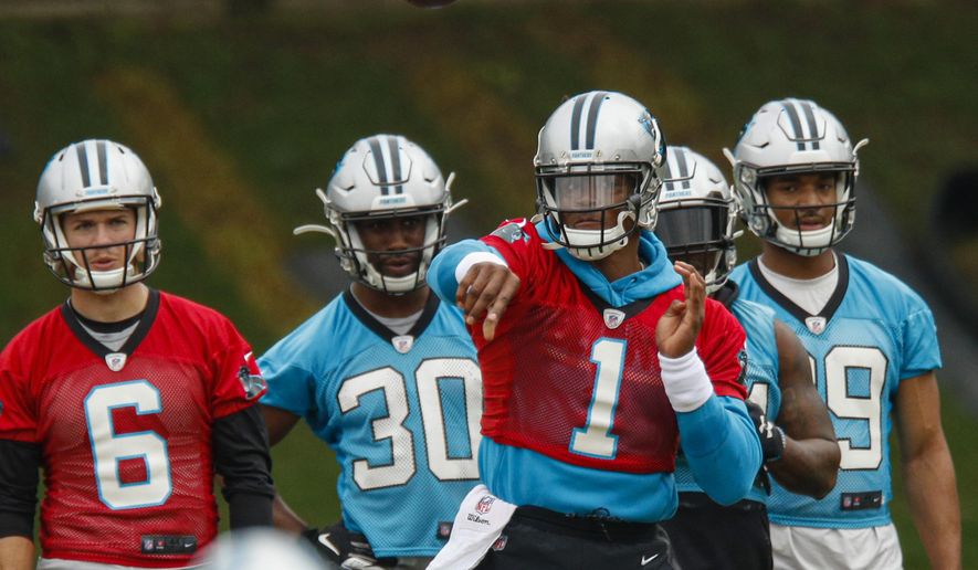 FILE - In this June 13, 2019, file photo, Carolina Panthers quarterback Cam Newton (1) throws a pass during the NFL football team's practice in Charlotte, N.C. While Cam Newton has been medically cleared to throw in training camp following shoulder surgery, Panthers coach Ron Rivera said the team’s training staff will closely monitor his reps. (AP Photo/Nell Redmond, File)