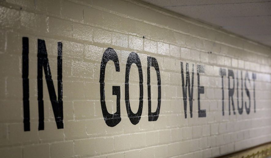 &quot;In God We Trust&quot; is stenciled in a wall at South Park Elementary in Rapid City, South Dakota in this July 23, 2019, photo. (Adam Fondren/Rapid City Journal via AP) **FILE**