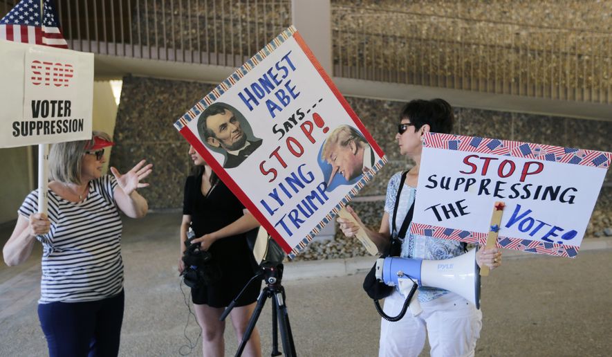 FILE - In this July 10, 2017, file photo, protesters gather outside the federal courthouse in San Antonio, where a redistricting trial was taking place. Putting aside "grave concerns" over Texas' record on voting rights in recent years, a federal court Wednesday, July 24, 2019, said the state doesn't need federal supervision to change voting laws in a key ruling ahead of the 2020 Census. (AP Photo/Eric Gay, File)