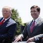 President Donald Trump, left, sits with Secretary of Defense Mark Esper, during a full honors welcoming ceremony for Esper at the Pentagon, Thursday, July 25, 2019, in Washington. (AP Photo/Alex Brandon)