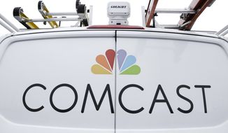 FILE - This Jan. 24, 2019, file photo shows a Comcast truck in Pittsburgh. Comcast Corp. continued to add internet customers while dropping video subscribers in the second quarter. The company’s profit slipped but a key earnings measure topped Wall Street expectations. Shares were flat in morning trading Thursday, July 25. (AP Photo/Gene J. Puskar, File)