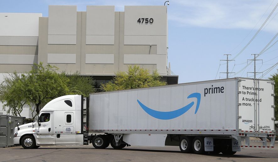This Wednesday, July 17, 2019 photo shows an Amazon shipping truck at a fulfillment center in Phoenix. Amazon.com Inc. reports financial earnings on Thursday, July 25. (AP Photo/Ross D. Franklin)