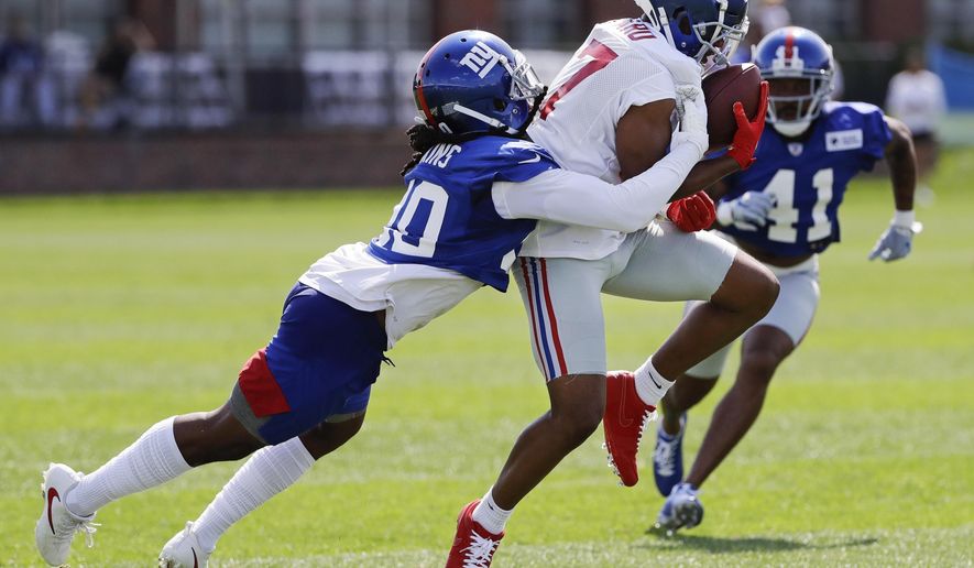 New York Giants' Janoris Jenkins, left, defends New York Giants' Sterling Shepard at the NFL football team's training camp in Thursday, July 25, 2019, in East Rutherford, N.J. Shepard suffered a thumb fracture during practice. (AP Photo/Frank Franklin II)