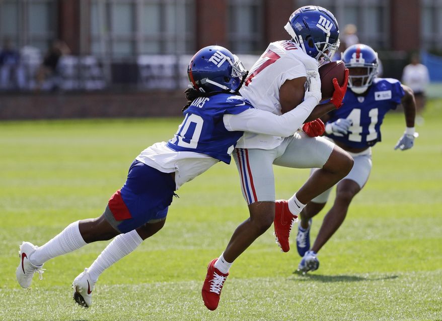 New York Giants' Janoris Jenkins, left, defends New York Giants' Sterling Shepard at the NFL football team's training camp in Thursday, July 25, 2019, in East Rutherford, N.J. Shepard suffered a thumb fracture during practice. (AP Photo/Frank Franklin II)