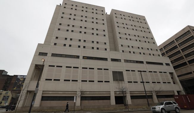 This Feb. 20, 2019 file photo, shows the exterior of the Cuyahoga County Corrections Center in Cleveland. A memo obtained by The Associated Press shows a recent state inspection of the troubled county jail has found problems with medical care and other issues persist months after they were cited during previous inspections.  (AP Photo/Tony Dejak, File)