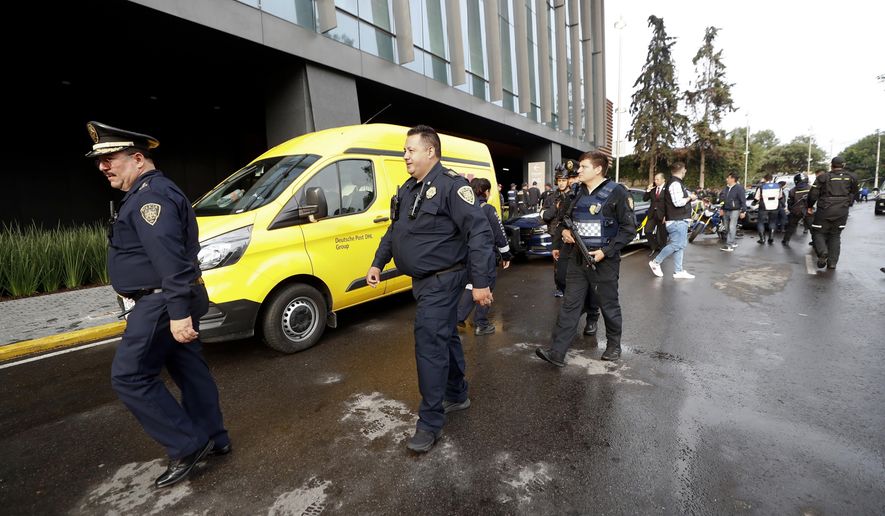 Police arrive at an upscale shopping mall at the south of Mexico City, Wednesday, July 24, 2019, where a woman wearing a blond wig disguise killed two Israeli men. Authorities said the woman and another man sat down at a table near the victims before she rose and shot the two Israelis at close range. According to Mexico City police chief Jesus Orta the woman said, "she had a sentimental relationship with one of the victims, who she met on social media, and that the attack was due to infidelity." (AP Photo)