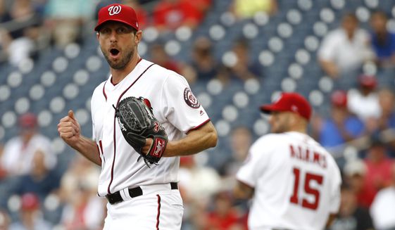 Washington Nationals starting pitcher Max Scherzer reacts after third baseman Anthony Rendon threw out Colorado Rockies&#39; Raimel Tapia at first base on a ground ball in the second inning of a baseball game, Thursday, July 25, 2019, in Washington. (AP Photo/Patrick Semansky)