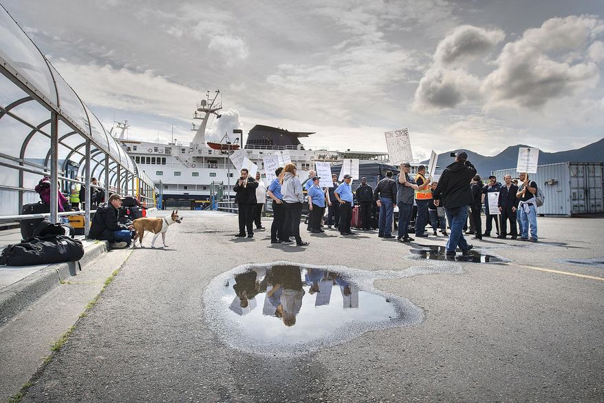 Some of the crew from the Alaska Marine Highway System ferry Columbia assemble for an Inlandboatmen's Union of the Pacific strike after failing to reach agreement on a contract with the state of Alaska, Wednesday, July 24, 2019, in Ketchikan, Alaska. (Dustin Safranek/Ketchikan Daily News via AP)