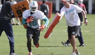 Miami Dolphins wide receiver Allen Hurns (86) runs drills during NFL football training camp, Friday, July 26, 2019, in Davie, Fla. Hurns, who suffered a leg injury with the Dallas Cowboys in January, signed a $3 million one-year contract Friday to play for his hometown team. (AP Photo/Lynne Sladky)