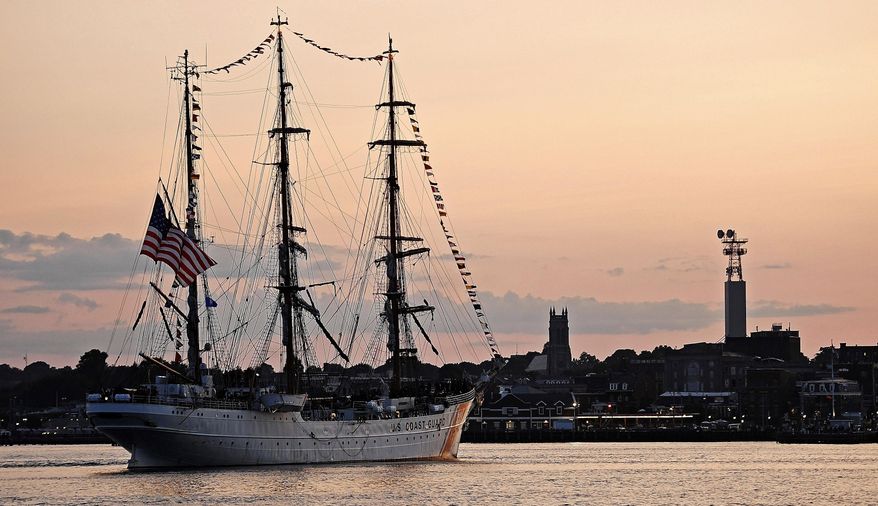 The U.S. Coast Guard Barque Eagle approaches City Pier in New London, Conn., just after sunset Thursday, July 25, 2019. The Eagle has been across the Atlantic training Coast Guard Academy cadets all summer and is back in its home port of New London to exchange 3rd class cadets for swabs before it departs again to finish out the summer training schedule. The ship has been home-ported at the Coast Guard yard in Baltimore for the last five years undergoing extensive overhauls to extend the ship's life but will return to New London as its homeport this fall. A welcome home ceremony is scheduled for Friday afternoon at City Pier in New London. (Sean D. Elliot/The Day via AP)