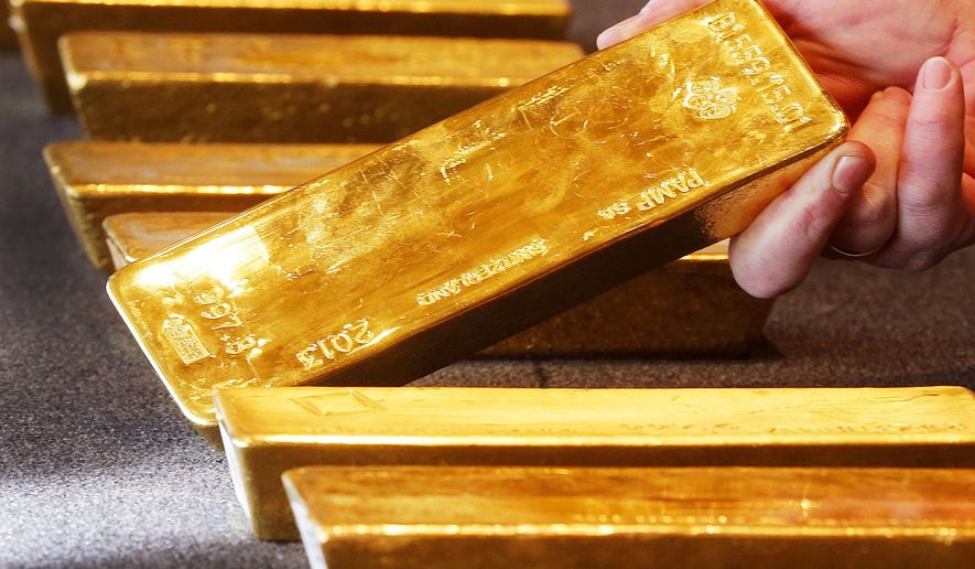 FILE - In this Feb. 9, 2017 file photo various gold bars are on display at the Bundesbank headquarter in Frankfurt, Germany. (AP Photo/Michael Probst.file)