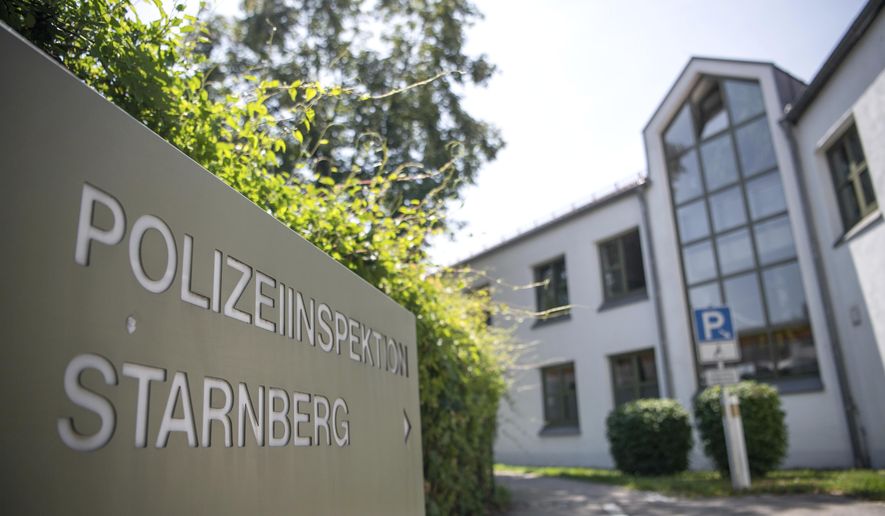 Picture shows a police station where some 50 teenagers have tried to enter to free one of their peers who was detained at a high school graduation party for rioting, Starnberg, Germany, Friday, July 26, 2019. Police in the town of Starnberg said Friday the intoxicated 15-year-old teenager was detained because a security guard at the party. (Sina Schuldt/dpa via AP)