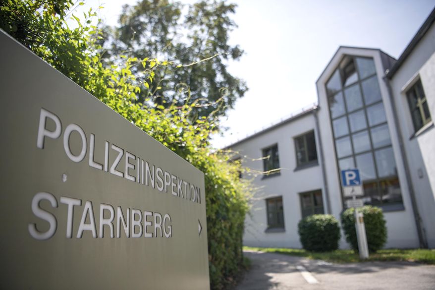 Picture shows a police station where some 50 teenagers have tried to enter to free one of their peers who was detained at a high school graduation party for rioting, Starnberg, Germany, Friday, July 26, 2019. Police in the town of Starnberg said Friday the intoxicated 15-year-old teenager was detained because a security guard at the party. (Sina Schuldt/dpa via AP)