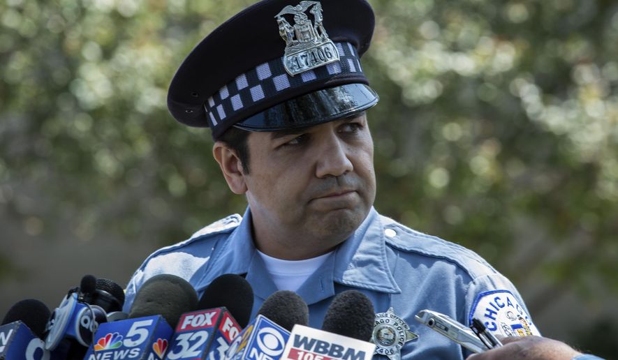 Chicago police officer Jose Jara talks to the media outside a police station in Chicago on Wednesday, July 24, 2019. He briefed the media about an investigation into a video showing several young girls or women beating a 15-year-old girl as onlookers laugh. (Zbigniew Bzdak/Chicago Tribune via AP)