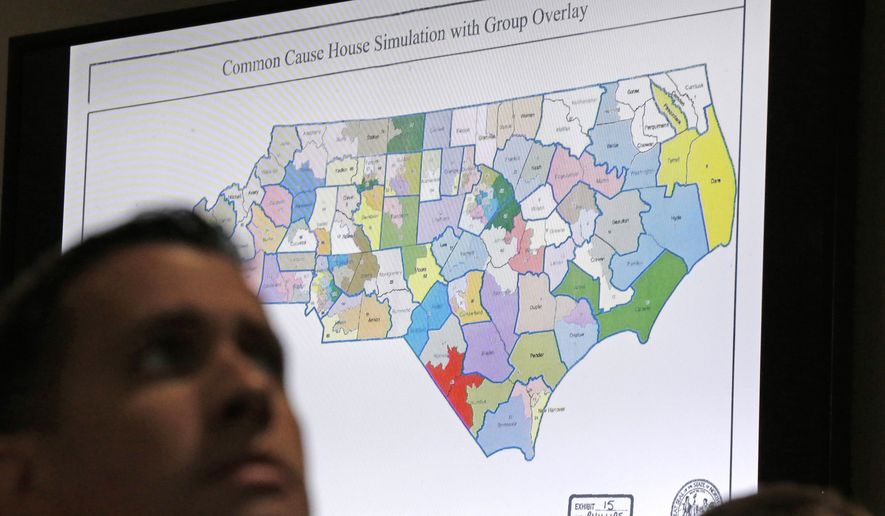 FILE - In this Monday, July 15, 2019 file photo, a districts map is shown as a three-judge panel of the Wake County Superior Court presides over the trial of Common Cause, et al. v. Lewis, et al at the Campbell University School of Law in Raleigh, N.C. The three-judge North Carolina panel was considering Friday, July 26, 2019, whether politicians can be too extreme in drawing legislative voting districts to their advantage, a judgment the U.S. Supreme Court refused to make about congressional elections. (AP Photo/Gerry Broome, File)