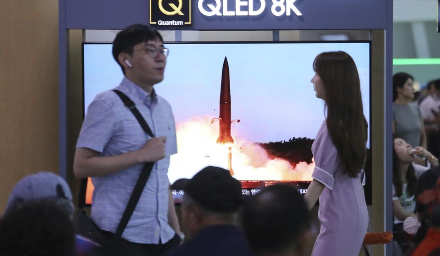 People watch a TV showing an image of North Korea's missile launch during a news program at the Seoul Railway Station in Seoul, South Korea, Friday, July 26, 2019. A day after two North Korean missile launches rattled Asia, the nation said Friday it had tested a "new-type tactical guided weapon" that was meant as a "solemn warning" about South Korean weapons development and its plan to hold military exercises. (AP Photo/Ahn Young-joon)
